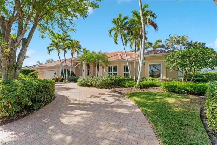 Mediterranean / spanish-style home with a garage