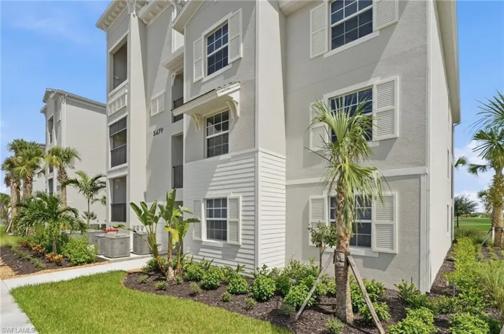 Multi-story exterior with stucco finish and horizontal siding accents