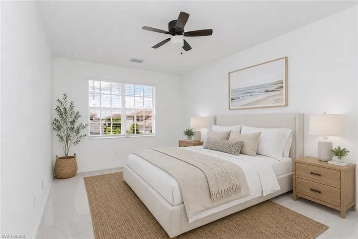 Recessed lighting throughout, light-colored walls, wood-finish flooring, ceiling fan, and large window with blinds