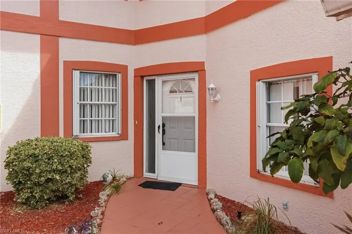 View of exterior entry with stucco siding