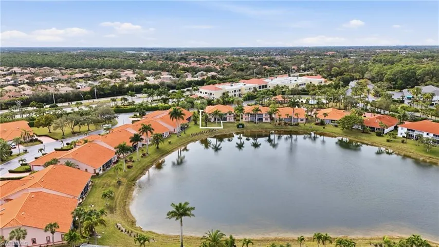 Aerial perspective of suburban area with a nearby body of water