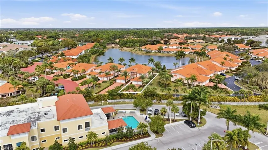 Aerial perspective of suburban area with a nearby body of water