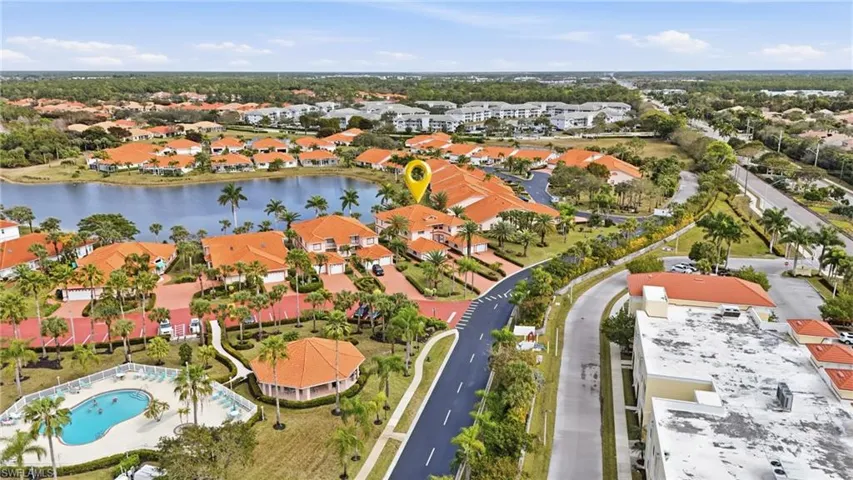 Aerial overview of property's location featuring a nearby body of water and nearby suburban area