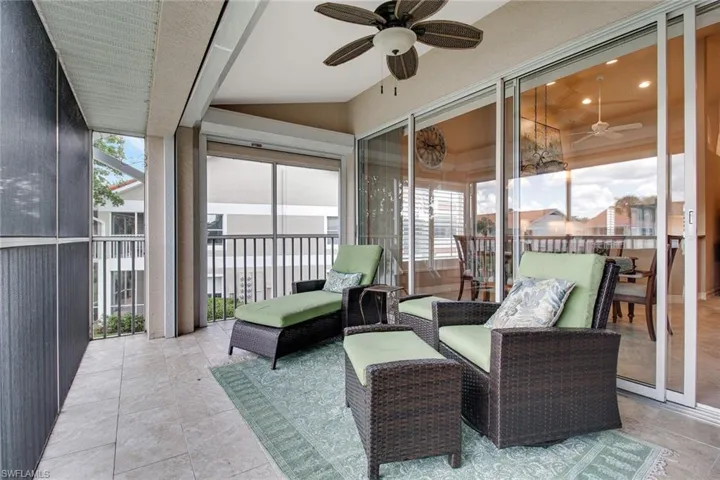 Sunroom featuring ceiling fan and lofted ceiling