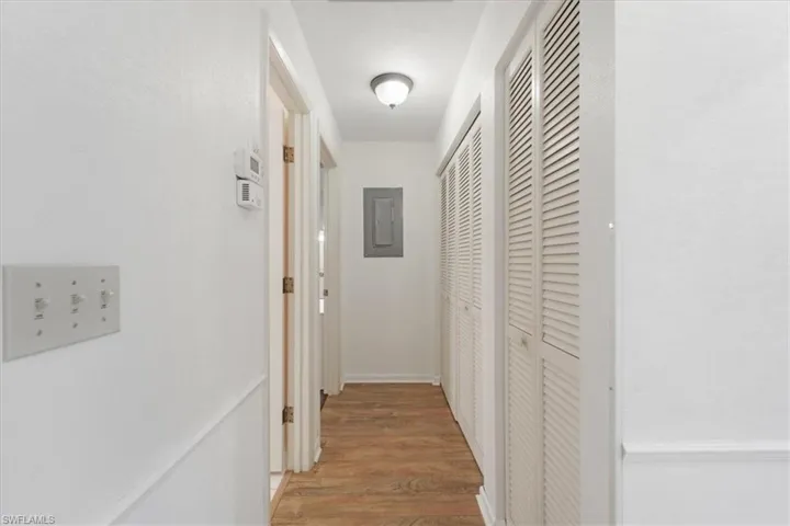 Hallway featuring hardwood / wood-style floors