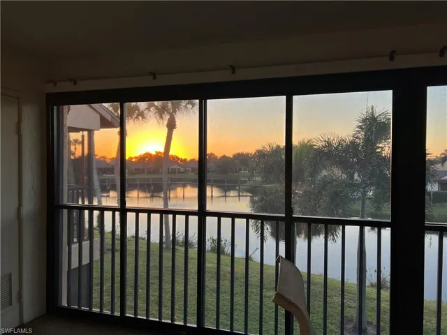 Unfurnished sunroom featuring a water view and healthy amount of natural light