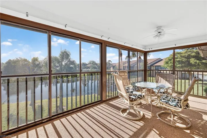Sunroom / solarium with a water view