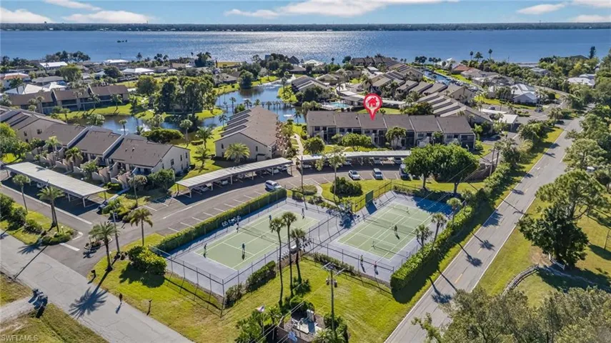 Aerial perspective of suburban area with a nearby body of water