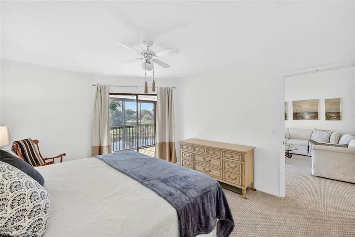 Bedroom with carpet, access to outside, and a ceiling fan