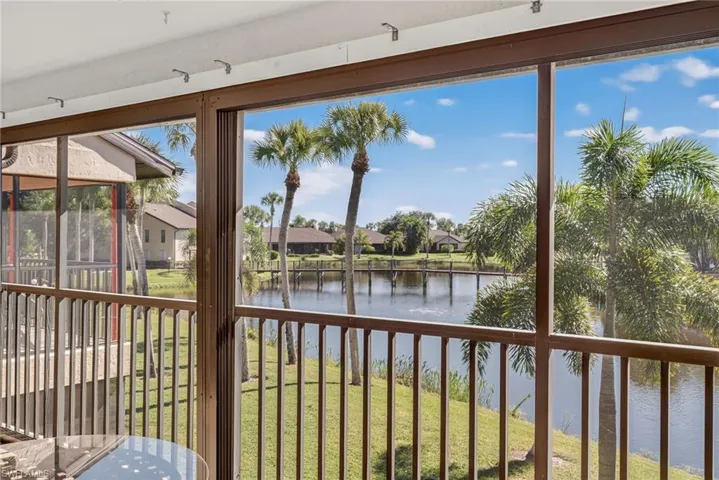 Unfurnished sunroom featuring a water view