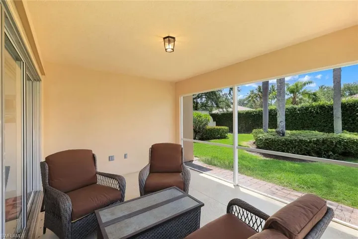 Screened patio featuring a solid ceiling, recessed lighting, and a neutral-toned exterior wall