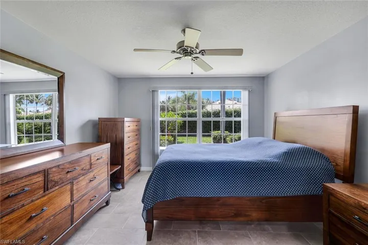 Spacious room featuring neutral wall tones and tile flooring