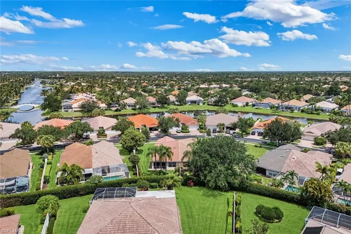 Expansive residential community with numerous properties featuring terracotta-style roofing
