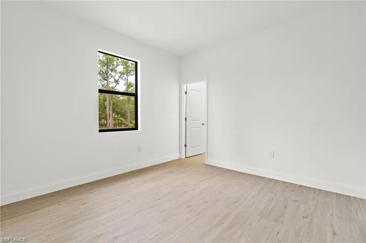 Spare room with light hardwood / wood-style floors