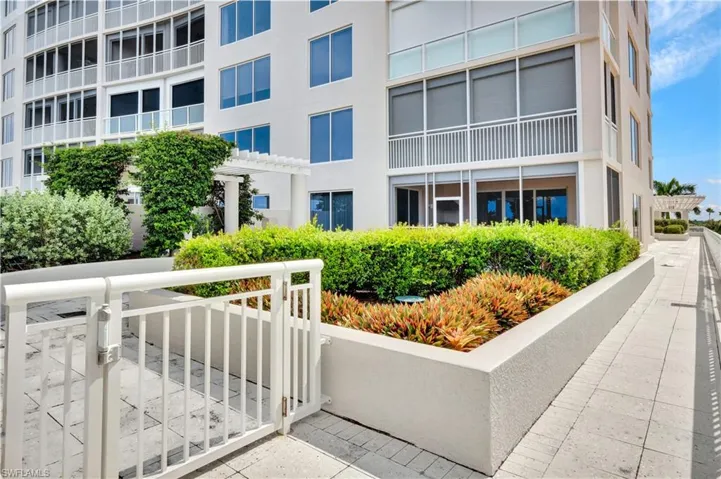 The walkway to the rear stairs and the resort style pool. Gorgeous landscaping!