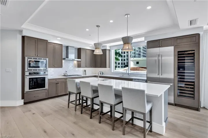 The kitchen provides ample storage space with modern cabinets.