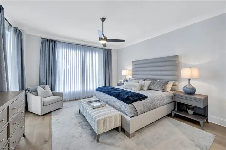 Following a day at the beach club or on the golf course, this lovely primary suite is where you will happily "recharge."