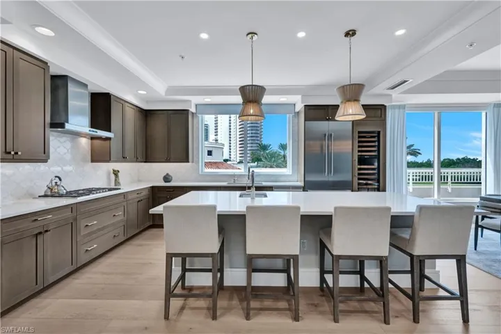 Gas stovetop, pull out drawers in all bottom cabinets, a huge island, TWO sinks and so much more!