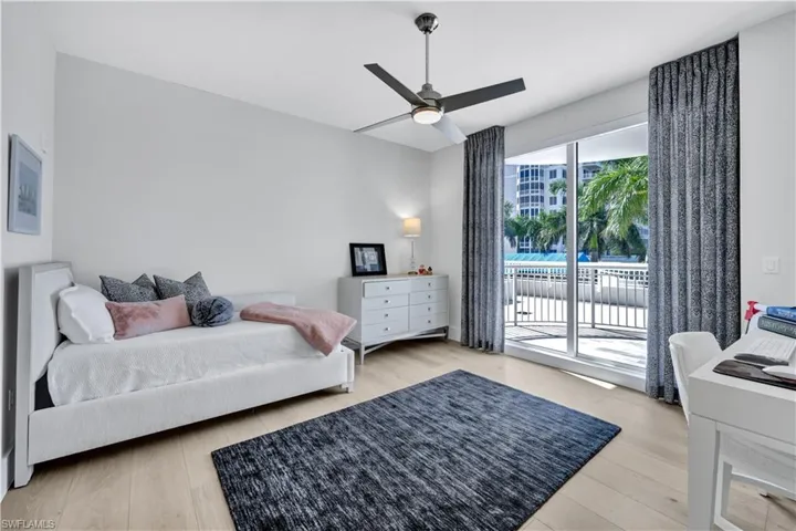Second guest bedroom with en suite bathroom and balcony.