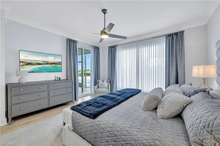 The primary bedroom suite boasts lanai access and 2 large closets with custom built-ins.