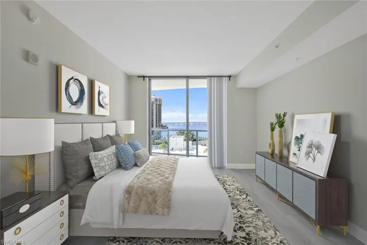 Master with river view Bedroom featuring floor to ceiling windows with river view.  Ensuite Bathroom - Virtual Staged