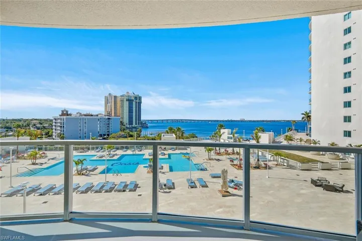 Large Balcony featuring views over the pool deck & river