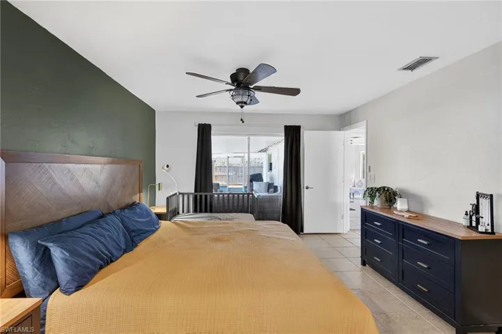 Bedroom featuring ceiling fan and light tile patterned flooring