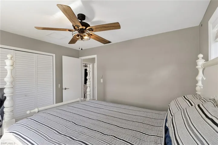 Bedroom with a closet and ceiling fan