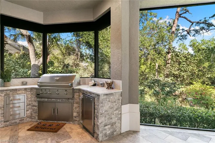 View of patio featuring exterior kitchen
