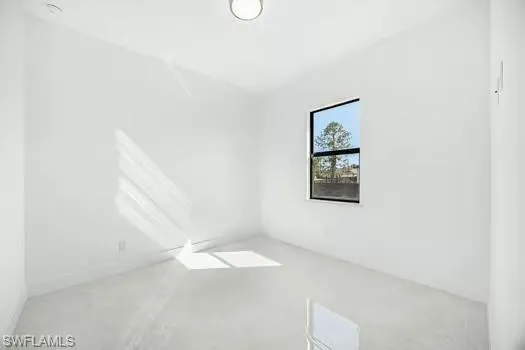Spare room with finished concrete floors