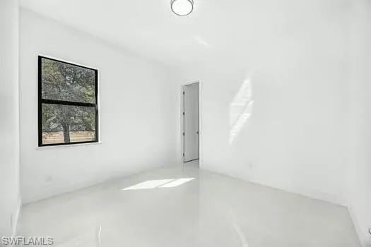 Spare room featuring concrete floors