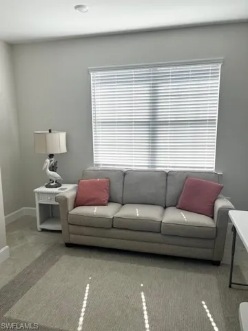 Living area featuring baseboards