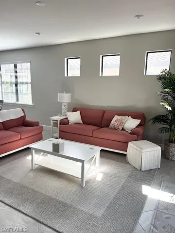 Living area featuring carpet flooring