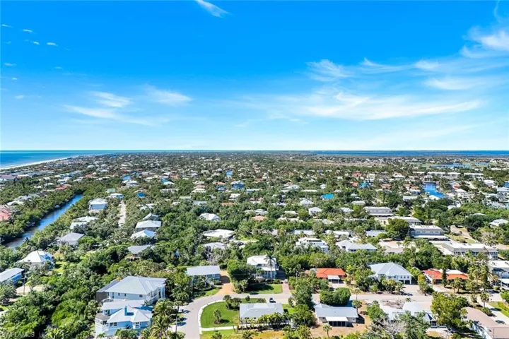 Aerial perspective of suburban area with a large body of water