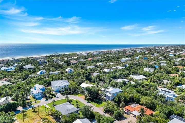 Aerial view of residential area with a nearby body of water