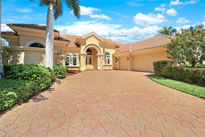 Mediterranean / spanish-style home featuring a garage