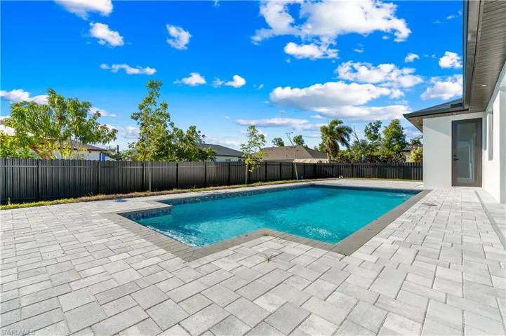 View of pool with a fenced backyard, a fenced in pool, and a patio
