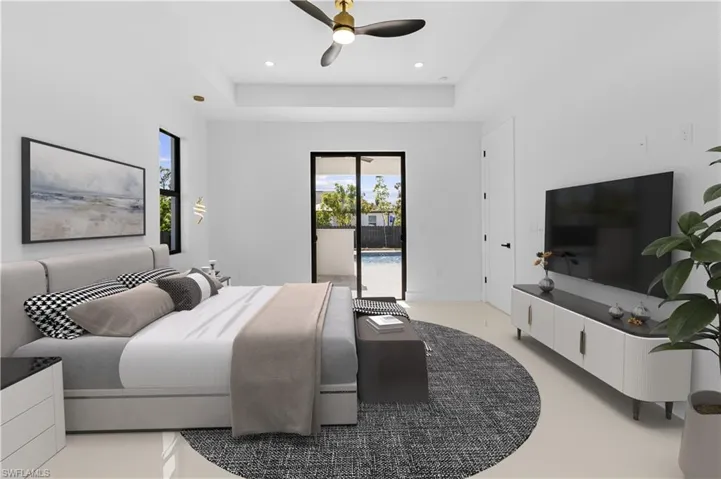 Bedroom featuring access to outside, recessed lighting, a raised ceiling, and a ceiling fan