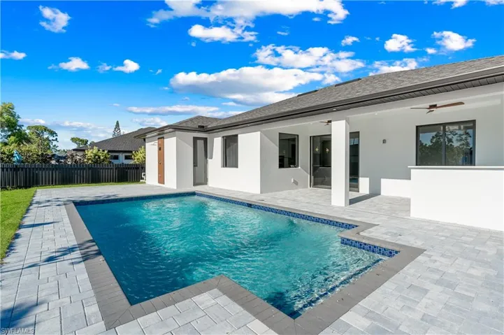 View of pool with a fenced in pool, a patio, ceiling fan, and fence