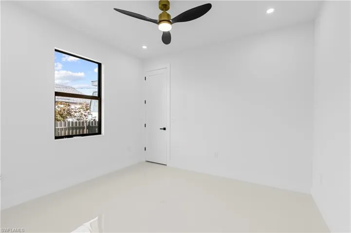 Spare room with baseboards, recessed lighting, and ceiling fan