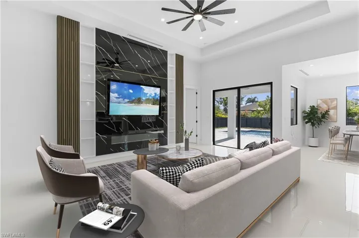 Living room with ceiling fan, recessed lighting, and plenty of natural light