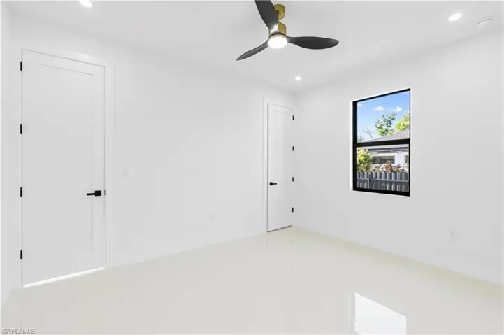 Unfurnished bedroom with ceiling fan, baseboards, and recessed lighting