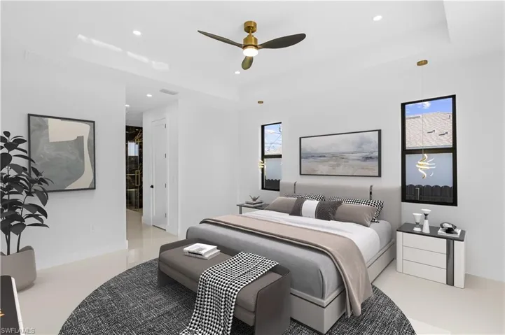 Bedroom with recessed lighting, a raised ceiling, and a ceiling fan