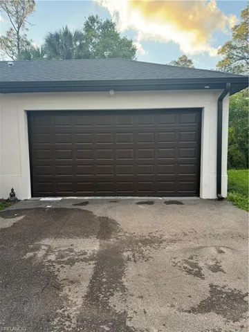 Garage featuring driveway