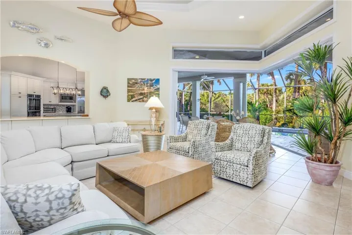 Living room opens up to the gorgeous pool and lanai with the vanishing sliders