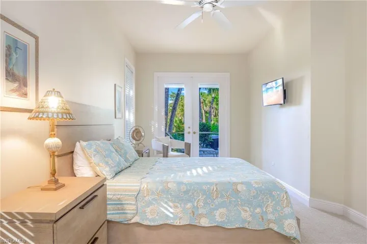 Bedroom #3 with french doors out to the lanai