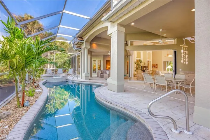 Inviting pool and spa borders a spacious lanai