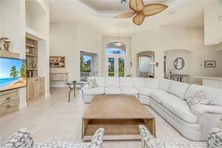 Living Room looking out to beautiful front doors - loads of natural light graces this open floor plan
