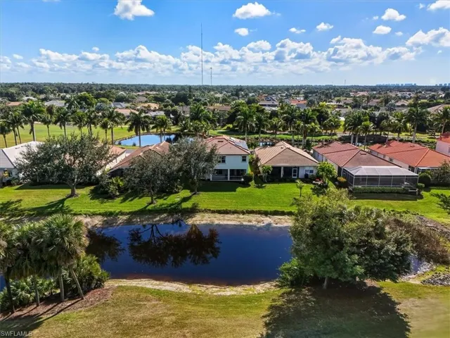 Aerial view of residential area featuring a large body of water