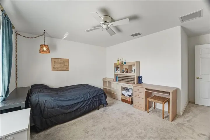 Bedroom featuring carpet floors and ceiling fan